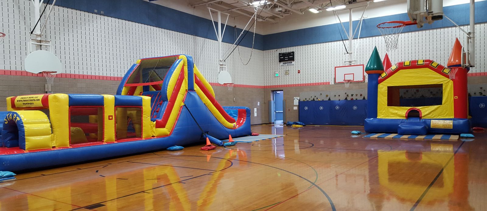 Inflatable Obstacle Course and Bounce House in school gym